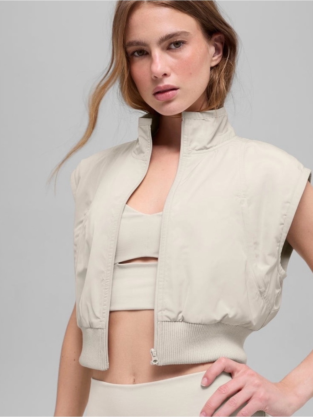 ALO Yoga Cropped Sleeveless Puffer Vest in Light Beige
